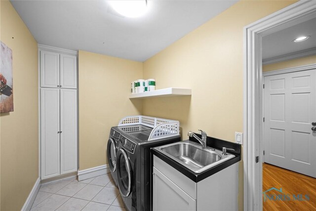26741 Green Ville Dr, Perrysburg, OH 43551 - laundry room featuring washing machine and dryer, cabinet space, baseboards, light tile patterned flooring, and recessed lighting