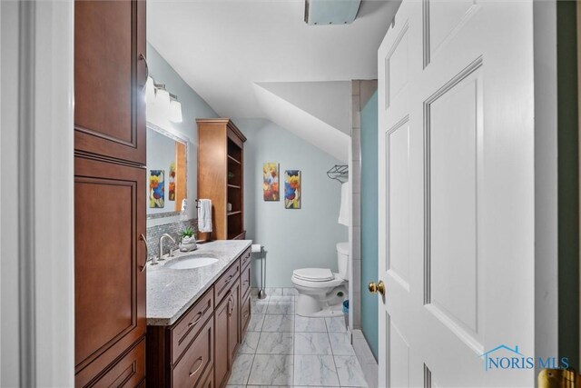 26741 Green Ville Dr, Perrysburg, OH 43551 - bathroom featuring vanity, toilet, marble look tile flooring, vaulted ceiling, and baseboards