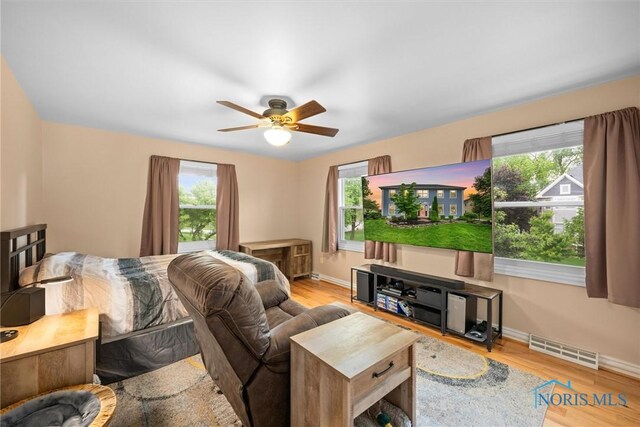 26741 Green Ville Dr, Perrysburg, OH 43551 - bedroom with baseboards, wood finished floors, and ceiling fan