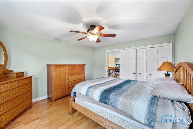 26741 Green Ville Dr, Perrysburg, OH 43551 - bedroom featuring light wood-style floors, a closet, baseboards, and ceiling fan