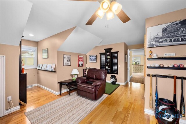 26741 Green Ville Dr, Perrysburg, OH 43551 - living area with wood finished floors, ceiling fan, baseboards, and vaulted ceiling