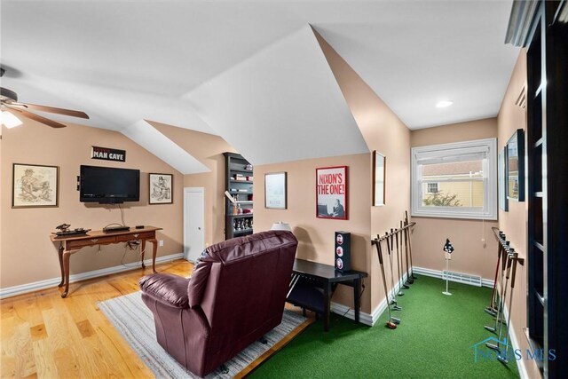 26741 Green Ville Dr, Perrysburg, OH 43551 - home theater room featuring a ceiling fan, baseboards, lofted ceiling, and wood finished floors