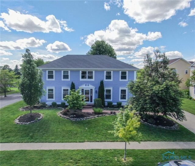 26741 Green Ville Dr, Perrysburg, OH 43551 - colonial house featuring a front lawn