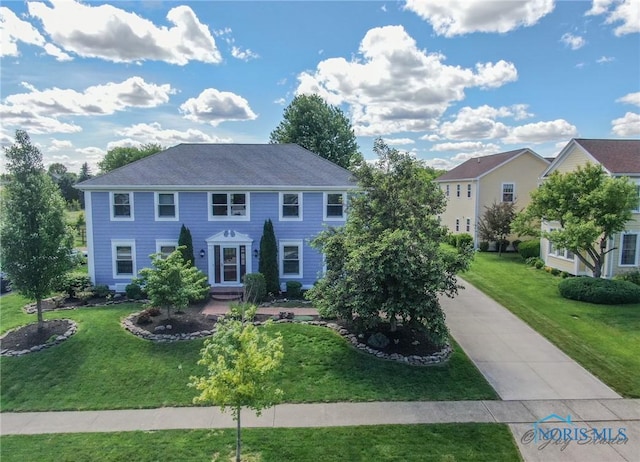 26741 Green Ville Dr, Perrysburg, OH 43551 - colonial inspired home featuring a front yard and driveway