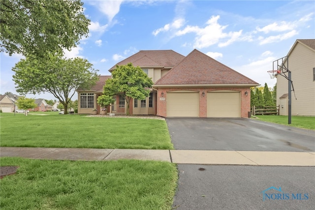 4729 Talon Trl, Maumee, OH 43537 - traditional-style house with an attached garage, brick siding, driveway, and a front yard