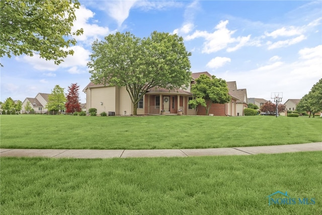 4729 Talon Trl, Maumee, OH 43537 - view of front of home with a porch and a front lawn
