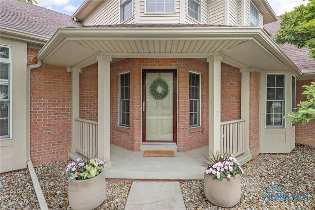 4729 Talon Trl, Maumee, OH 43537 - doorway to property with a porch and brick siding