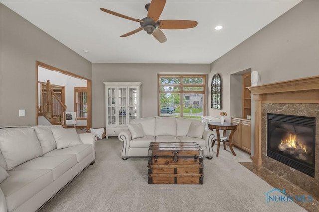 4729 Talon Trl, Maumee, OH 43537 - living area featuring carpet floors, a ceiling fan, a fireplace, stairway, and recessed lighting