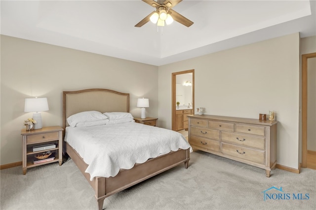 4729 Talon Trl, Maumee, OH 43537 - bedroom with light carpet, baseboards, ensuite bathroom, and a ceiling fan