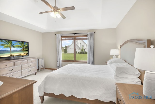 4729 Talon Trl, Maumee, OH 43537 - bedroom with light colored carpet, a raised ceiling, ceiling fan, and baseboards