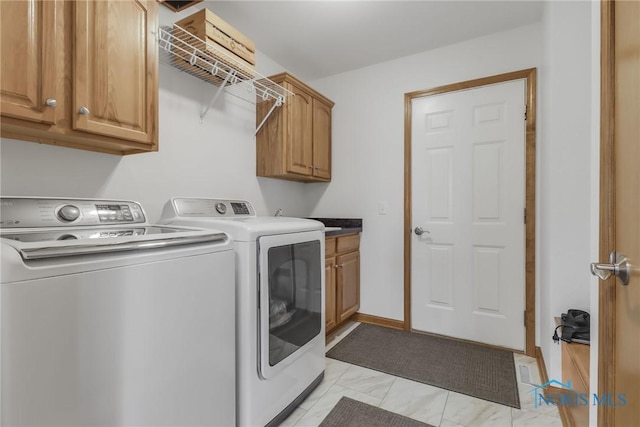 4729 Talon Trl, Maumee, OH 43537 - washroom featuring cabinet space, washing machine and dryer, and light marble finish floors