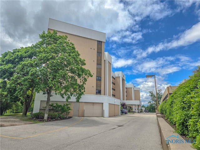 5831 Monroe St Unit 602, Sylvania, OH 43560 - view of building exterior featuring a garage