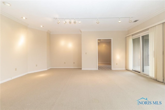 5831 Monroe St Unit 602, Sylvania, OH 43560 - unfurnished room featuring ornamental molding, baseboards, light colored carpet, and rail lighting