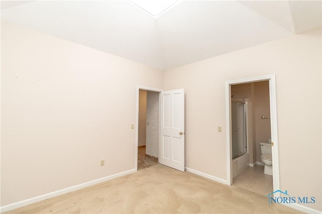 5831 Monroe St Unit 602, Sylvania, OH 43560 - unfurnished bedroom featuring light colored carpet, baseboards, and ensuite bath