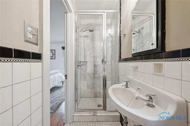 2256 Barrington Dr, Toledo, OH 43606 - ensuite bathroom with tile walls and a stall shower