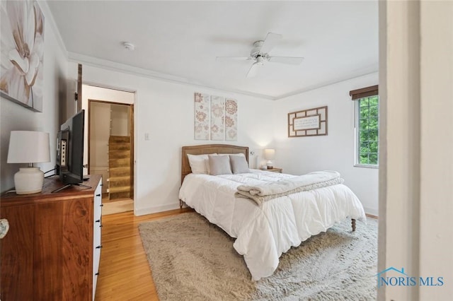 2256 Barrington Dr, Toledo, OH 43606 - bedroom featuring light wood-style floors, ornamental molding, baseboards, and ceiling fan