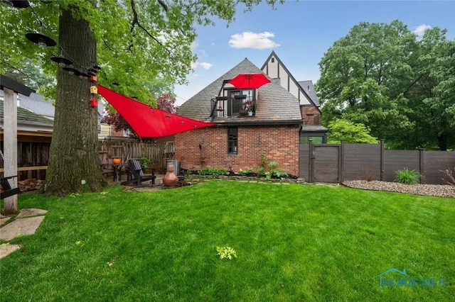 2256 Barrington Dr, Toledo, OH 43606 - back of house featuring brick siding and a gate