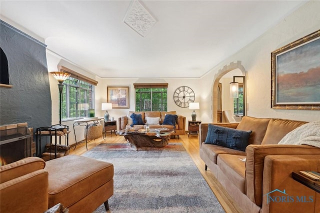 2256 Barrington Dr, Toledo, OH 43606 - living area featuring arched walkways, wood finished floors, and a textured wall