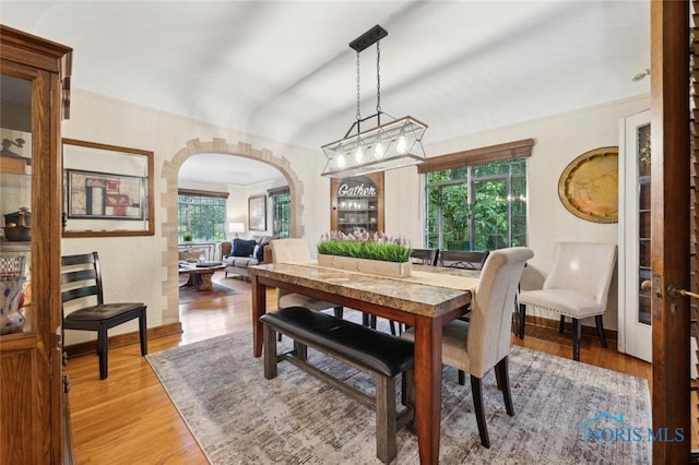 2256 Barrington Dr, Toledo, OH 43606 - dining space with plenty of natural light, arched walkways, and light wood-type flooring