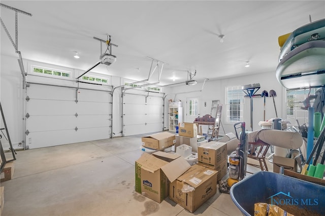 8740 Dorr St, Toledo, OH 43617 - garage featuring a garage door opener