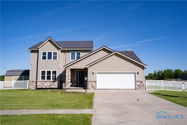 1500 S Jackson Ave, Defiance, OH 43512 - view of front facade featuring an attached garage, stone siding, driveway, and metal roof