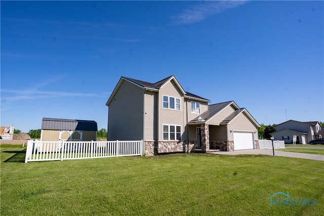1500 S Jackson Ave, Defiance, OH 43512 - view of front of house featuring driveway, stone siding, and an attached garage