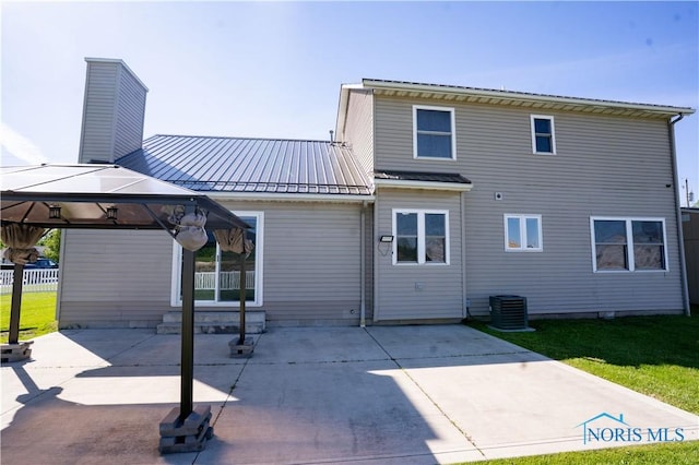 1500 S Jackson Ave, Defiance, OH 43512 - rear view of property with a gazebo, a patio, central AC, a lawn, and metal roof