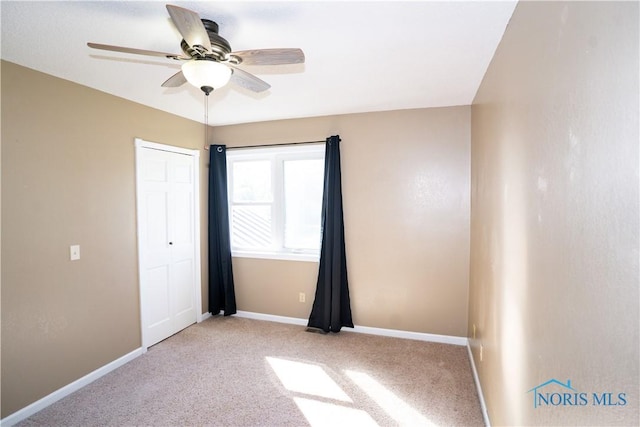 1500 S Jackson Ave, Defiance, OH 43512 - unfurnished room featuring baseboards, ceiling fan, and carpet floors