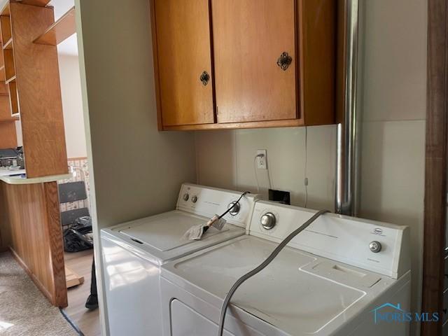 925 S Cherry St, Bryan, OH 43506 - washroom featuring washer and dryer and cabinet space