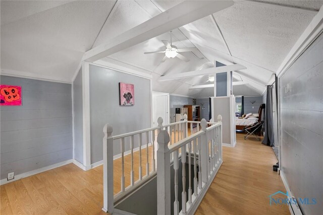 451 Toledo St, Elmore, OH 43416 - corridor featuring an upstairs landing, lofted ceiling, wood finished floors, and baseboards