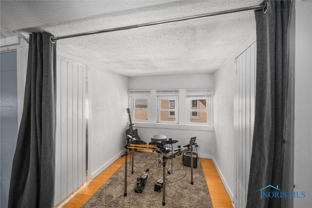 451 Toledo St, Elmore, OH 43416 - office featuring a textured ceiling, light wood-type flooring, and baseboards