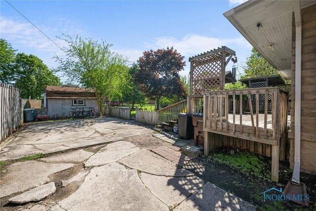 451 Toledo St, Elmore, OH 43416 - view of patio with a deck and an outbuilding