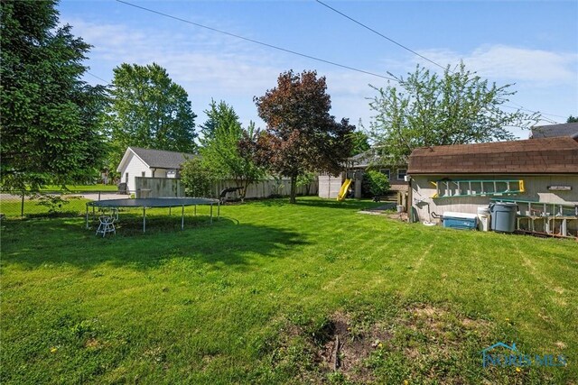 451 Toledo St, Elmore, OH 43416 - view of yard featuring a trampoline and a playground