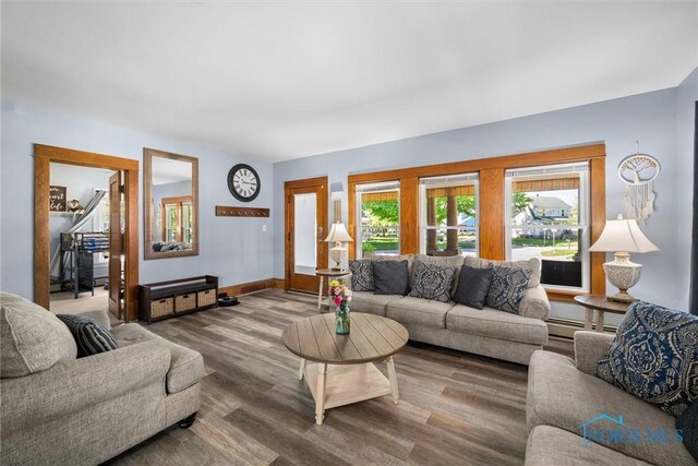 451 Toledo St, Elmore, OH 43416 - living room with wood finished floors, baseboard heating, and baseboards