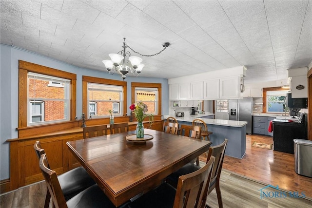 451 Toledo St, Elmore, OH 43416 - dining space featuring a chandelier, light wood-style flooring, and plenty of natural light