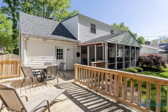 717 Birch St, Bowling Green, OH 43402 - wooden deck with a sunroom and outdoor dining space