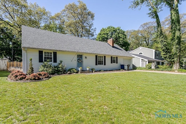 717 Birch St, Bowling Green, OH 43402 - view of front of home featuring a garage, a chimney, and roof with shingles