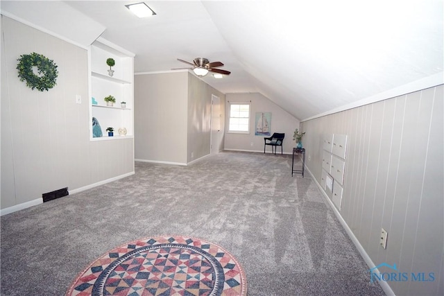 2621 Gloria Ct, Toledo, OH 43614 - bonus room with ceiling fan, carpet, baseboards, vaulted ceiling, and wood walls