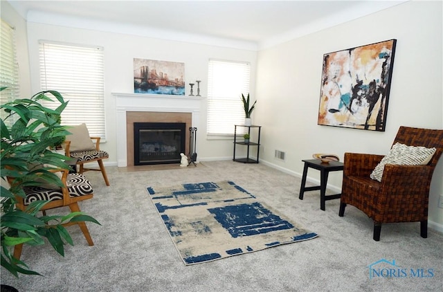 2621 Gloria Ct, Toledo, OH 43614 - sitting room featuring carpet floors, a fireplace with flush hearth, and baseboards