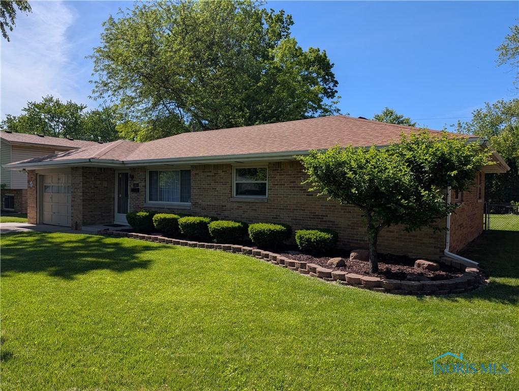 243 W S Boundary St, Perrysburg, OH 43551 - single story home featuring brick siding and an attached garage