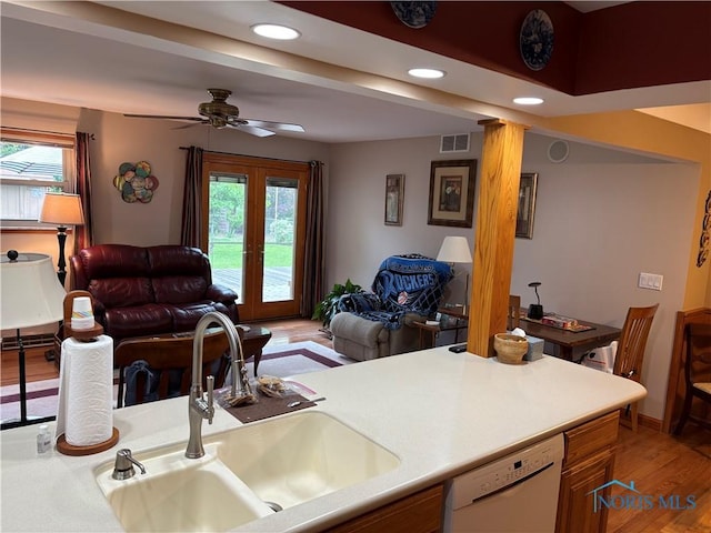 243 W S Boundary St, Perrysburg, OH 43551 - kitchen featuring dishwasher, a sink, open floor plan, light wood-style floors, and recessed lighting
