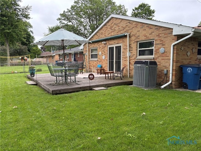 243 W S Boundary St, Perrysburg, OH 43551 - rear view of property with cooling unit, a deck, and brick siding