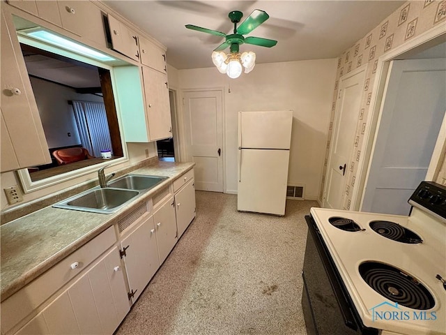 178 Gross St, Tiffin, OH 44883 - kitchen featuring white appliances, a sink, ceiling fan, light countertops, and white cabinetry
