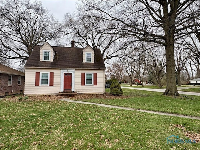 178 Gross St, Tiffin, OH 44883 - cape cod house featuring a front yard and a chimney