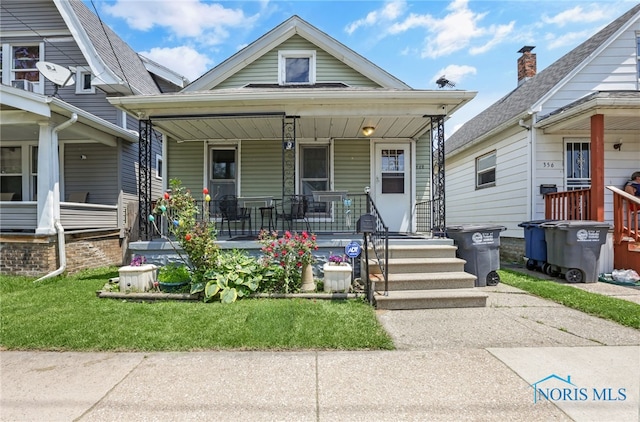 358 Burger St, Toledo, OH 43605 - shotgun-style home with covered porch
