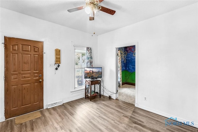 358 Burger St, Toledo, OH 43605 - entrance foyer with wood finished floors and a ceiling fan