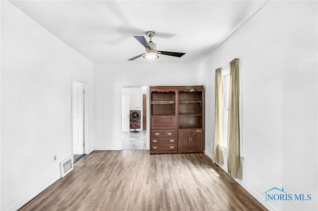 358 Burger St, Toledo, OH 43605 - empty room with wood finished floors and ceiling fan