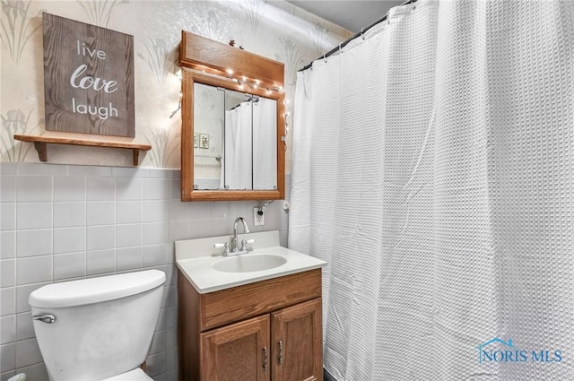 358 Burger St, Toledo, OH 43605 - bathroom with vanity, tile walls, tasteful backsplash, and a shower with curtain