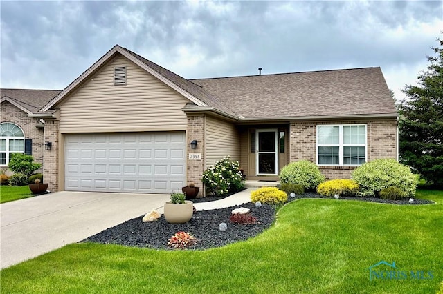 7358 Manatee Ct, Maumee, OH 43537 - ranch-style house with brick siding, a garage, driveway, a front yard, and roof with shingles