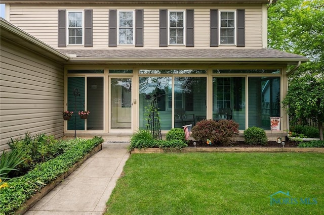 6200 Swiss Garden Rd, Toledo, OH 43612 - doorway to property with a lawn and roof with shingles